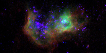 Colour composite image of the nearby blue compact dwarf (BCD) Mrk 71 showing WFC3 broad-band image of the stellar continuum in V-band (purple), and the narrow-band, continuum subtracted image of the ionized gas with F373N ([O II], red), F656N (Hα, blue), and F502N ([O III], green) down to a spatial scale of 0.0400/pixel (0.67 pc/pixel)