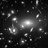 Image of gravity of this galaxy cluster (called Abell 2218) bends the light from more distant galaxies behind it